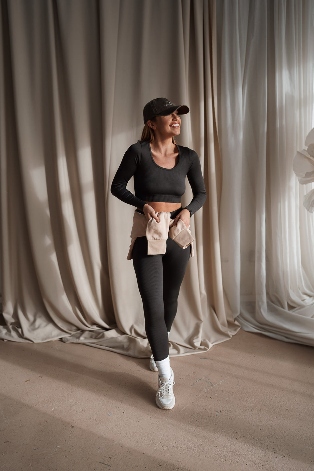 Sculpting ribbed grey activewear crop top with long sleeves and matching leggings by Pine & Treasure.