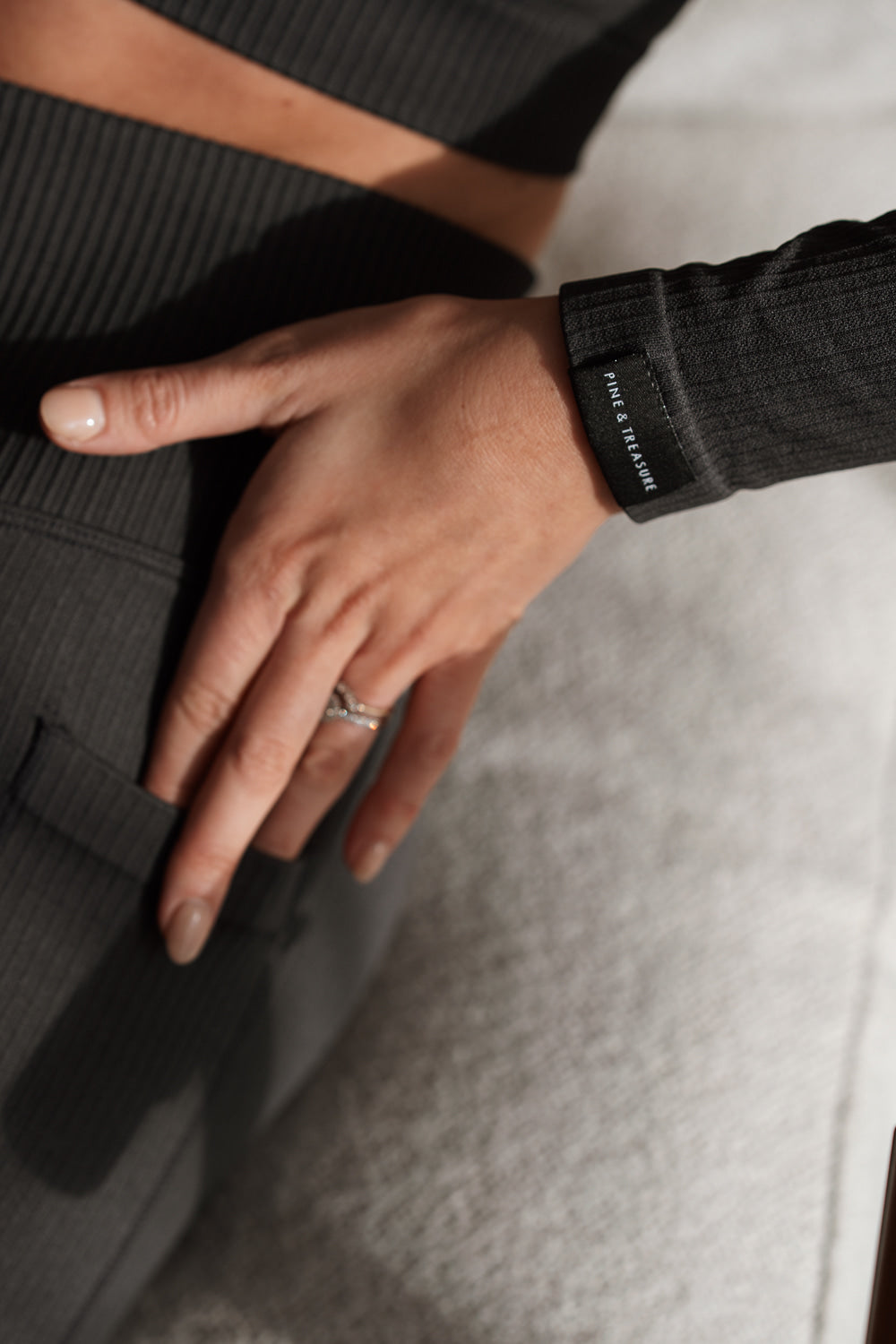 Sculpting ribbed grey activewear crop top with long sleeves and matching leggings by Pine & Treasure.