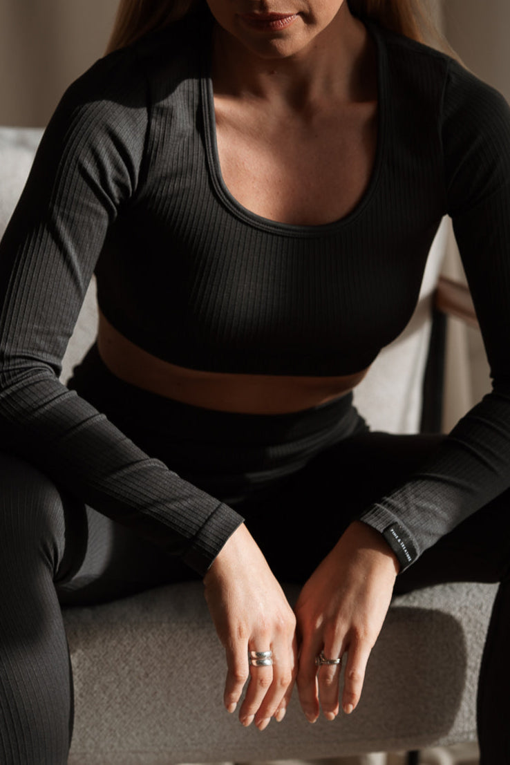 Sculpting ribbed grey activewear crop top with long sleeves and matching leggings by Pine & Treasure.